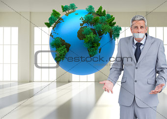 Composite image of businessman gagged with adhesive tape on mouth