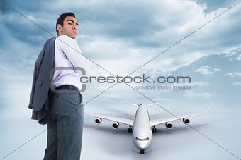 Composite image of unsmiling businessman standing