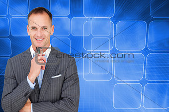 Composite image of smiling businessman holding glasses