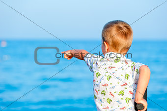 child points to something