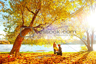 Mother and daughter in park during autumn