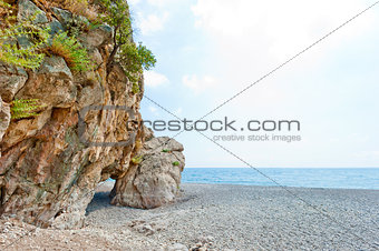grotto in the rock on the sea beach