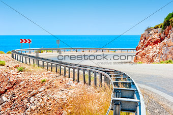 Sea and mountain highway fenced striker