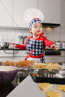 Young chef making cookies