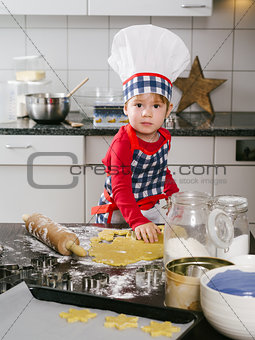 Young boy making cookies
