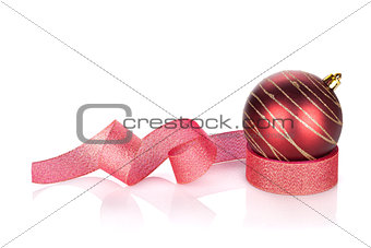 Red sparkling christmas bauble with ribbon