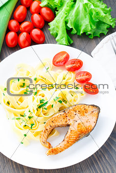 Delicious fettuccini with fried salmon