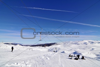 snowboarders on skilift