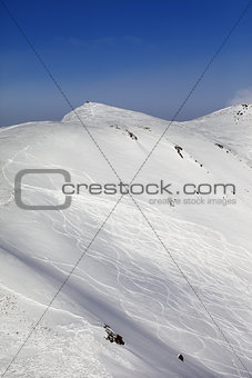 Off-piste ski slope with traces