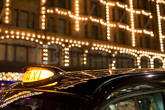 Taxi in London in front of a shopping center