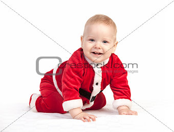 Happy little baby boy in Santa costume