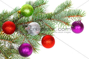 Many colored balls on the fir branch of Christmas tree