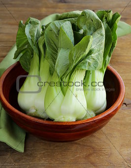 Bok choy (chinese cabbage) on a wooden table