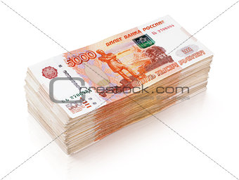 Heap of 5000 russian rubles banknotes on white