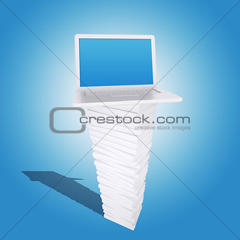 Laptop on a pile of white books