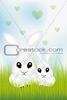 Adorable Easter rabbits in green grass