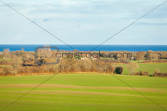 beautiful landscape in autum baltic see green field blue sky