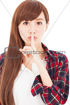  beautiful young woman with finger on lips