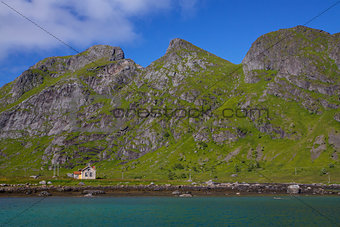 Abandoned house by fjord