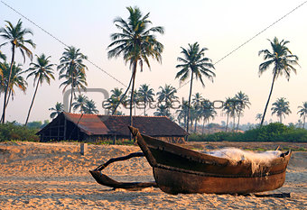 fishing boat on the sandy shore