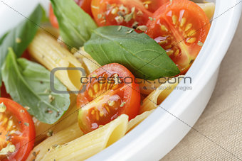 simple italian pasta penne with tomatoes and basil