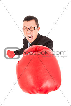 screaming businessman attack to enemy with boxing gloves