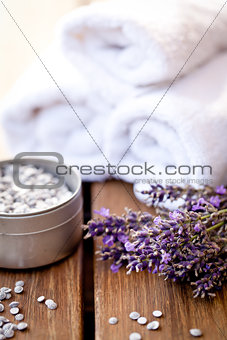 fresh lavender white towel and bath salt on wooden background