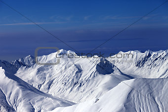 View on off-piste slopes and multicolor blue sky at nice sunny e