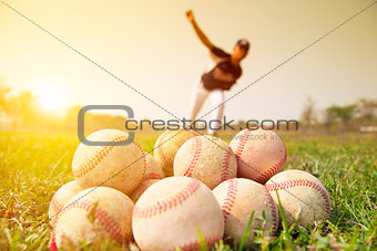 Baseball players practicing pitching outside