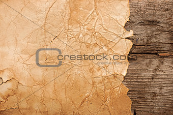 Grunge paper on wooden wall background