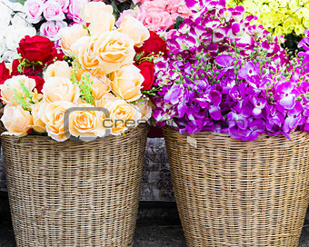 Fake fabric roses in basket
