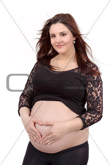 beautiful pregnant woman tenderly holding her tummy isolated on white background