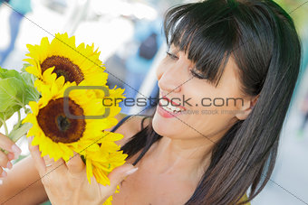 Pretty Italian Woman Looking at Sunflowers at Market