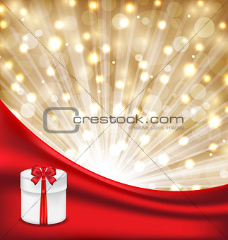 Gift box with red bow on glowing background