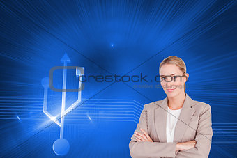 Composite image of confident female executive with folded arms