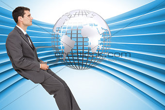 Composite image of classy young businessman sitting