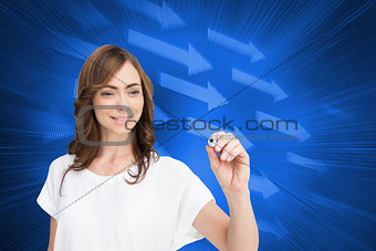 Composite image of smiling businesswoman holding marker