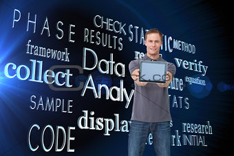 Composite image of young man showing screen of his tablet computer