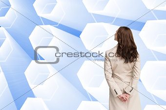 Composite image of rear view of businesswoman