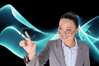 Composite image of smiling asian businesswoman pointing