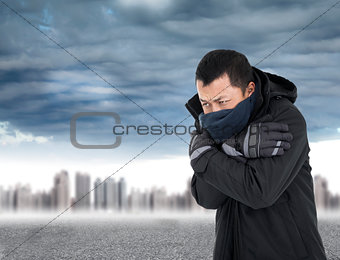 Young man tightening body in outdoors cold weather