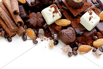 different varieties of chocolate and sweets on a white background