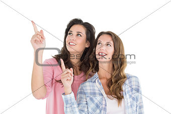 Friends pointing up against white background
