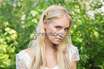 Blonde bride looking peacefully at camera