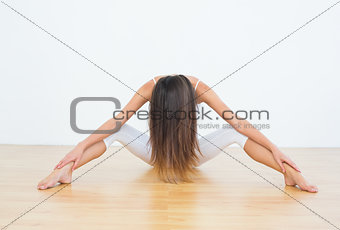 Woman with long hair in fitness studio
