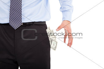 Business man grabbing  pocket money over white 