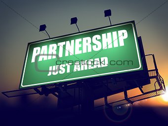 Partnership Just Ahead on Green Billboard.