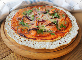 Pizza with mozzarella cheese , salmon, onion