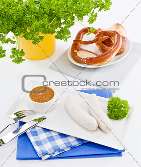 weisswurst white sausages and sweet mustard with pretzel 