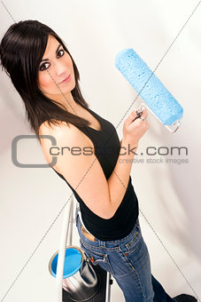 Attractive Handy Woman Using Paint Roller Blue Paint Project
